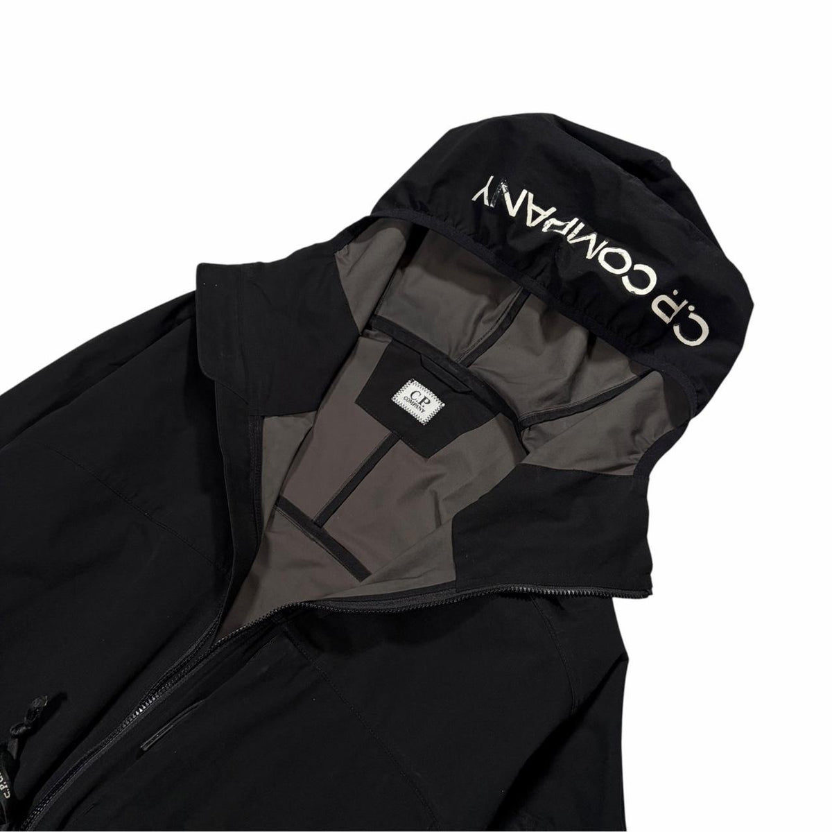 CP Company black Pro-Tek hood spellout jacket (M)