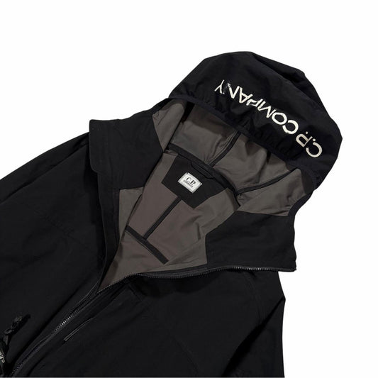 CP Company black Pro-Tek hood spellout jacket (M)