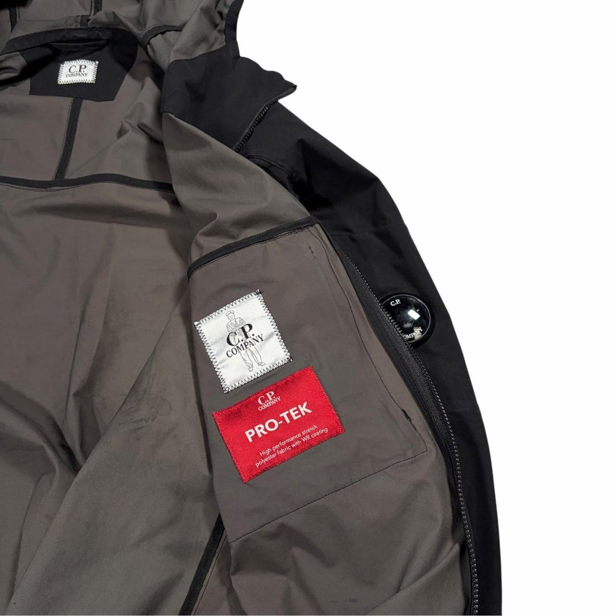CP Company black Pro-Tek hood spellout jacket (M)
